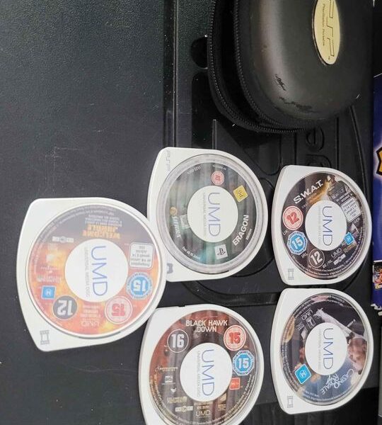 2 X PSP Consoles And 50 Games And 5 UMD Movies In Good Condition.