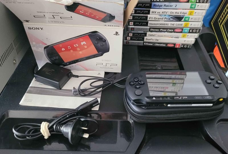 2 X PSP Consoles And 50 Games And 5 UMD Movies In Good Condition.