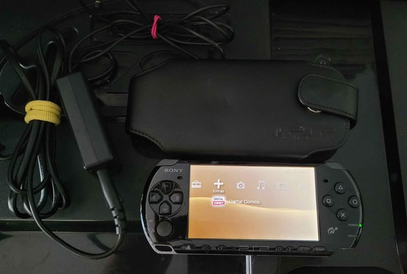 2 X PSP Consoles And 50 Games And 5 UMD Movies In Good Condition.