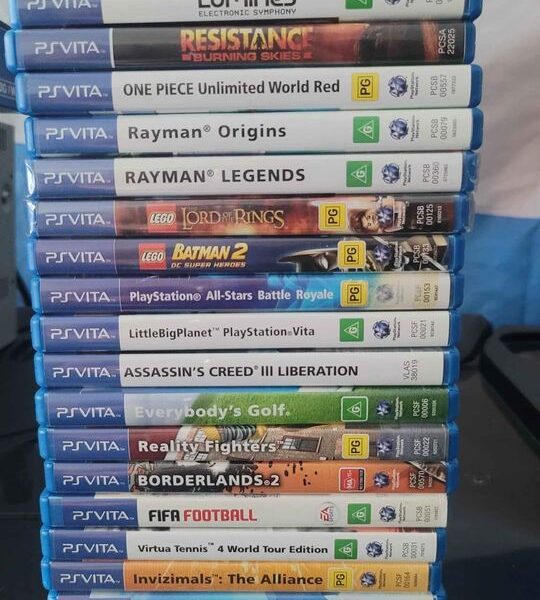 PS Vita Crystal Black Model PCH-1102 Boxed And 20 Games.