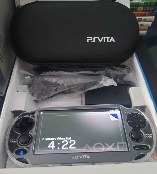 PS Vita Crystal Black Model PCH-1102 Boxed And 20 Games.