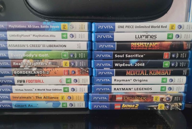 PS Vita Crystal Black Model PCH-1102 Boxed And 20 Games.